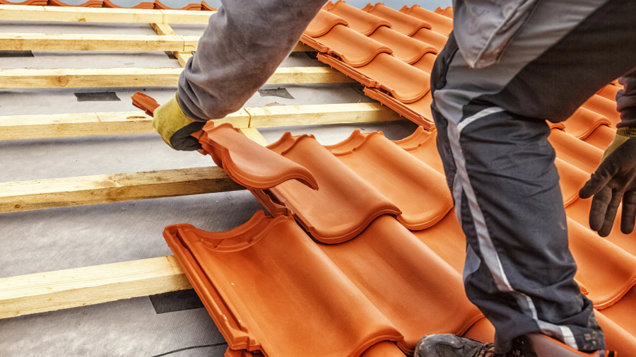 roofer installing tile roof in a house tempe az