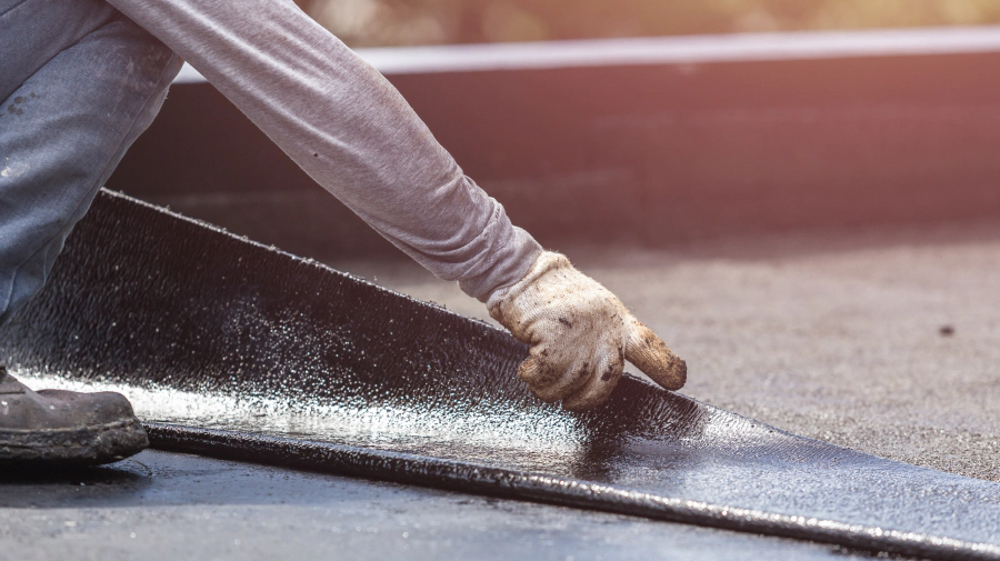 roofer working on a flat roof installation tempe az